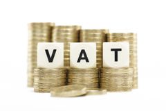 vat value added tax on gold coins on white backg 30108676 1